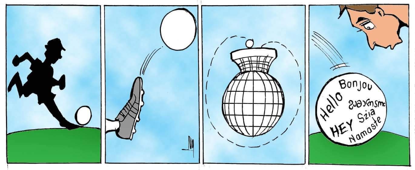 luy | Ruiz Healy Times Four-panel cartoon: a silhouette of a person kicking a ball, a sneaker kicking another ball, a spinning disco-ball globe, and a large ball on a hill covered with greetings in multiple languages (Hello, Bonjour, Namaste, Hey, Szia).